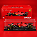 A 1/24 scale model of the Ferrari SF23 race car driven by Charles Leclerc, displayed inside a clear acrylic display case in front of its original red packaging box. The model features the signature red livery with black and yellow accents, and is set against a solid red background.