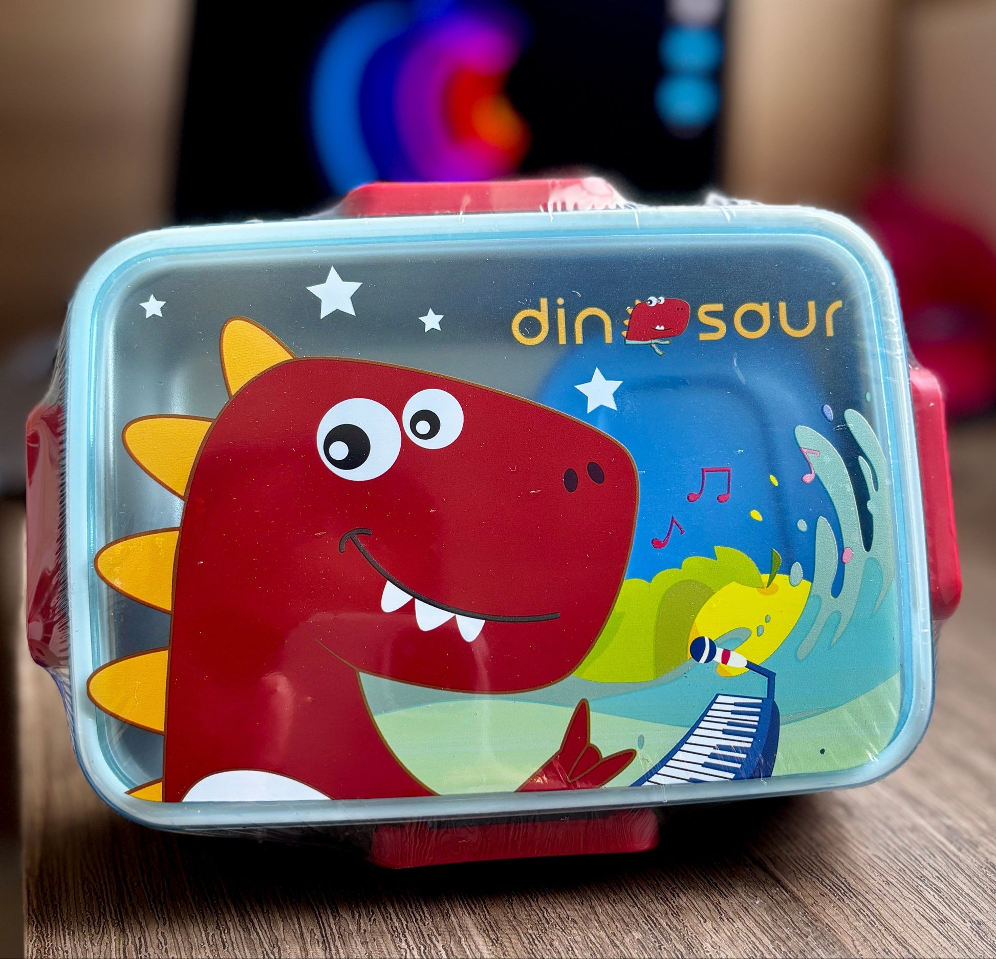 Children's small lunch box with dinosaur design 
