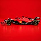 A red and black Ferrari Formula 1 race car with visible Shell, Pirelli, and other sponsor logos, photographed in profile against a solid red studio background.